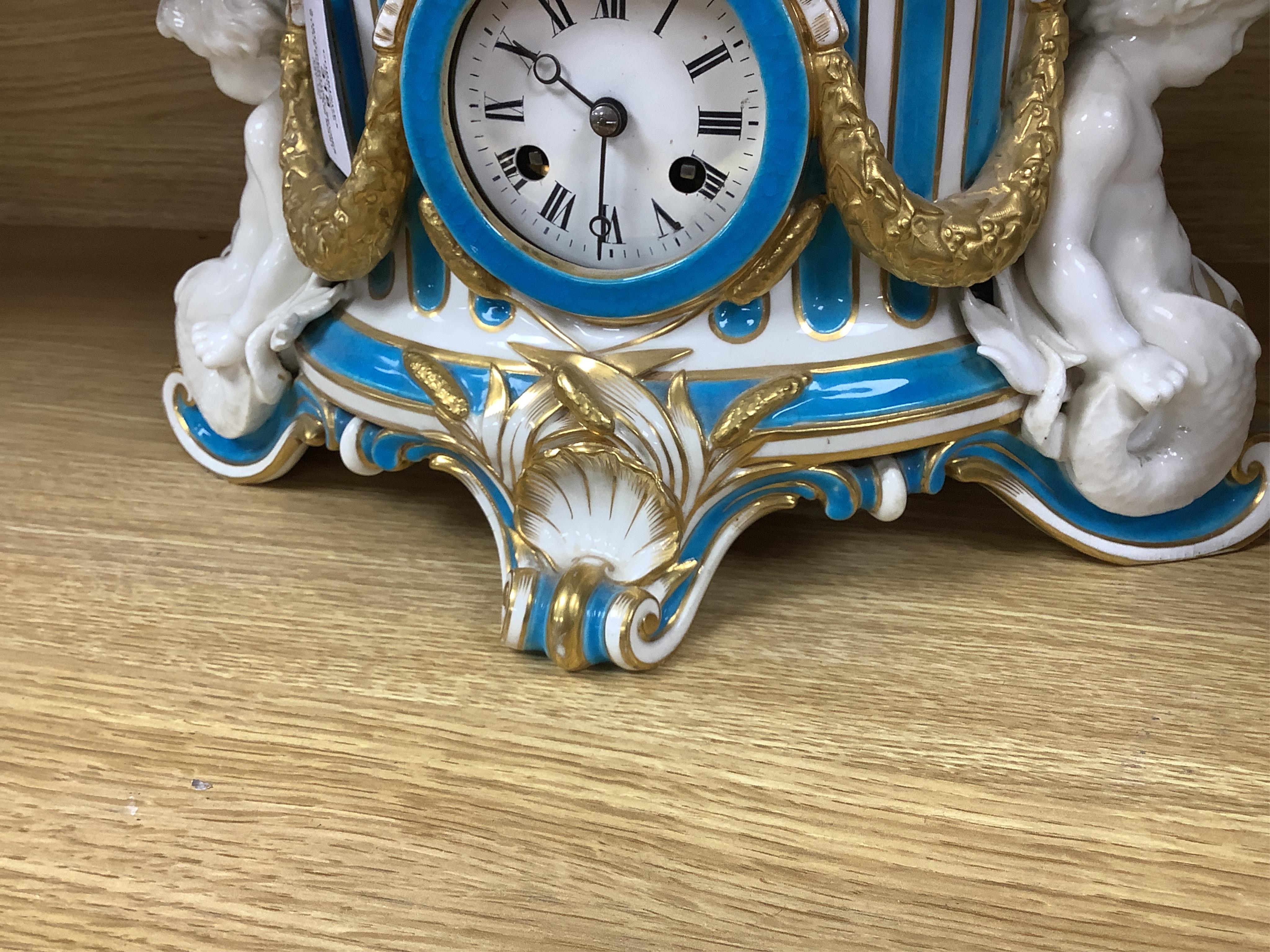 A 19th-century Sevres style porcelain mantel clock, 29cm tall